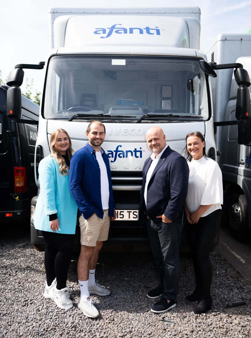 Afanti team stood in front of a branded truck