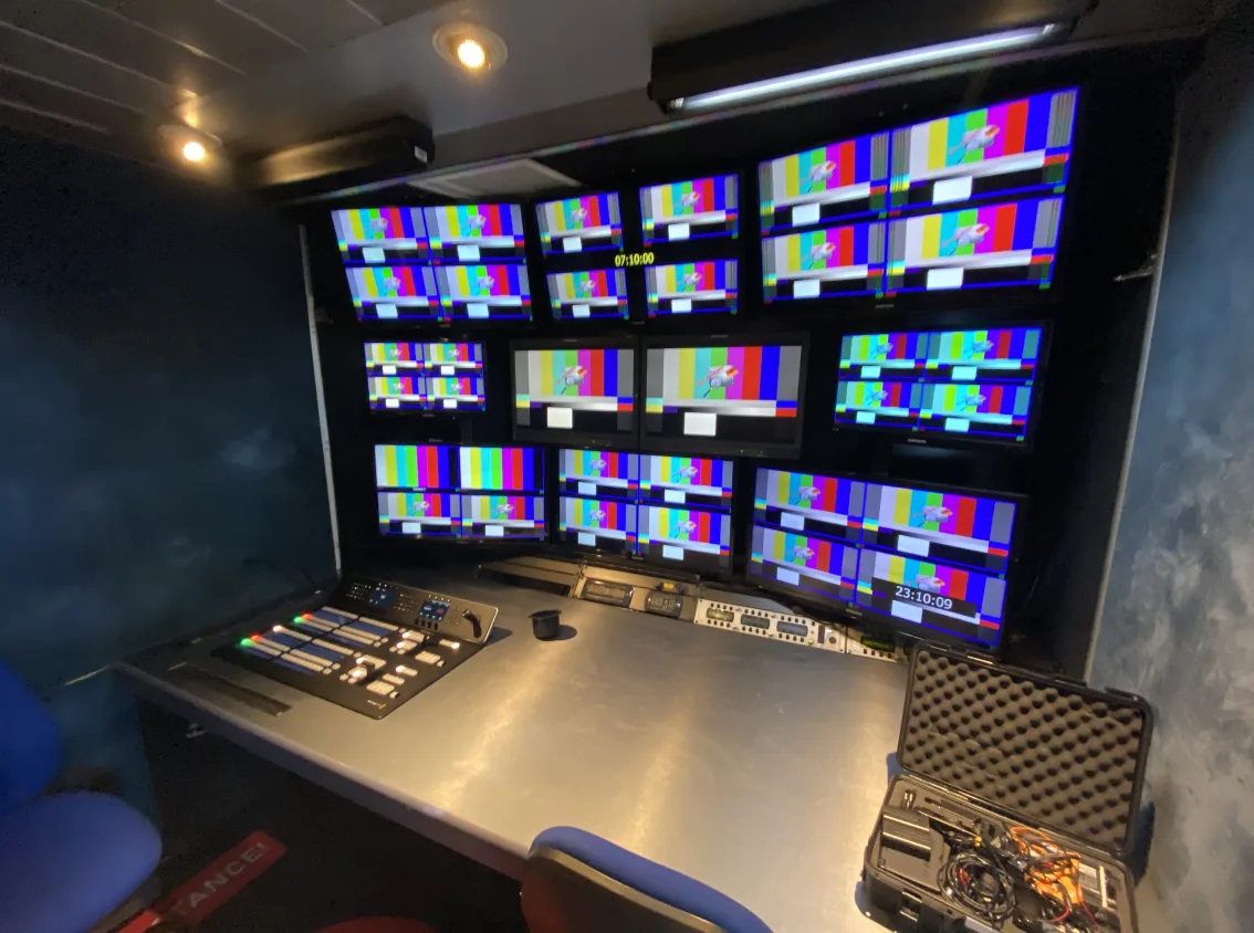 photo of a video editing suite with lots of monitors showing test footage