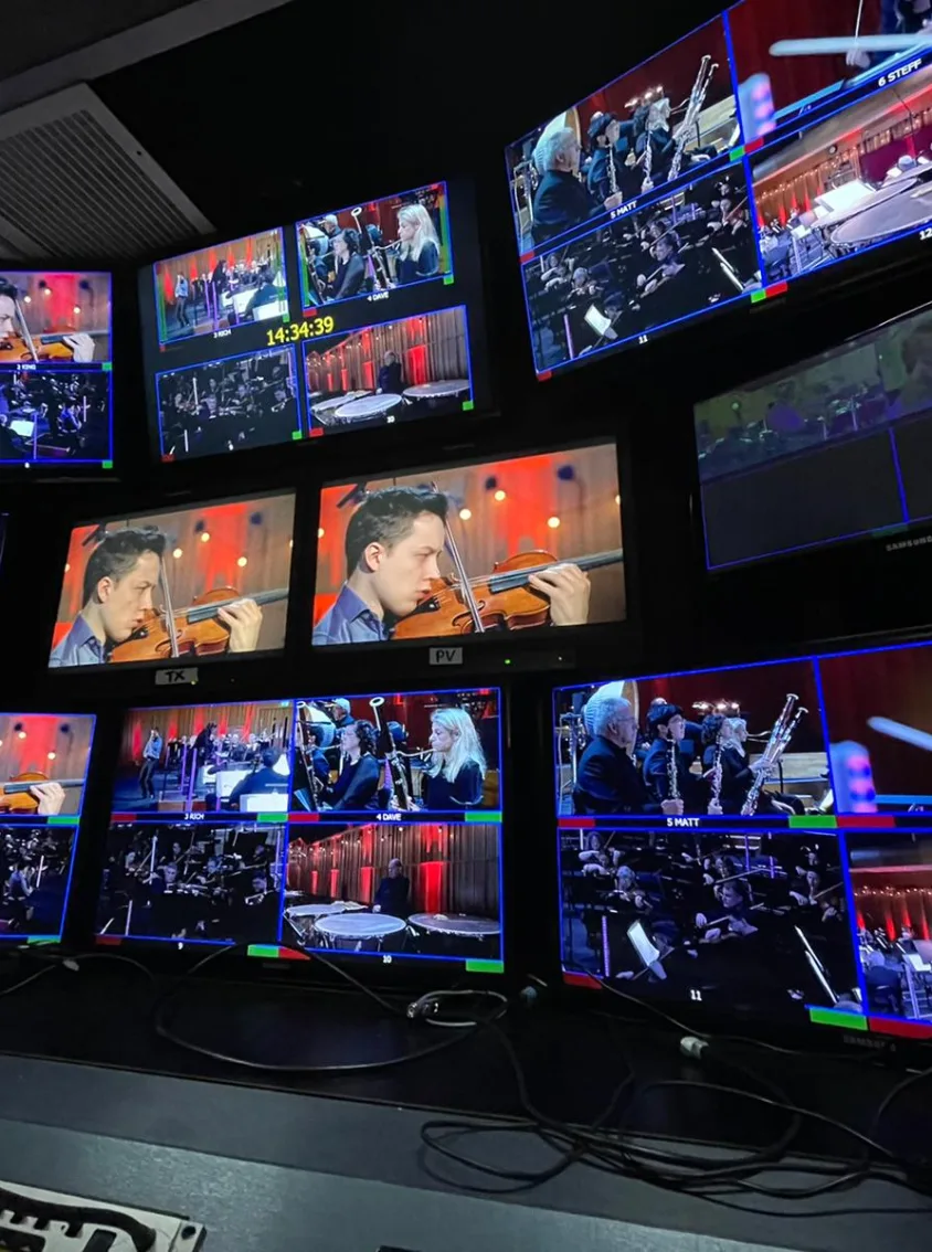 classical music performance being edited on multiple screens